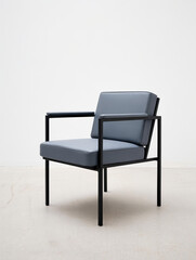 Fototapeta premium Modern Black Metal Frame Lounge Chair with Gray Cushions on Minimalist White Background