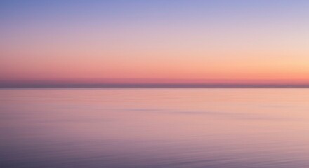 Blurry sunset over still water