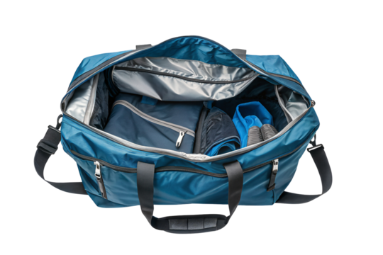 Overhead view of an open blue duffel bag filled with folded clothing and zippered compartments inside it on transparent background