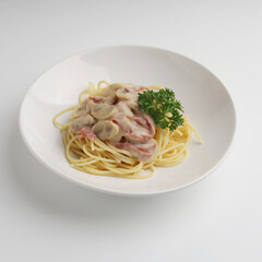 Spaghetti with mushroom sauce in a plate