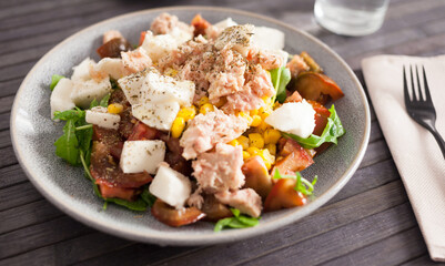 Closeup of salad with fish and vegetables for lunch