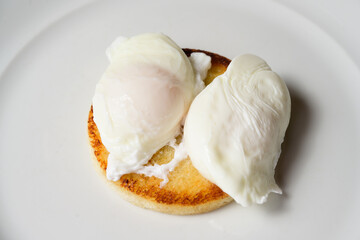 Two Poached Eggs on Toast on a White Plate