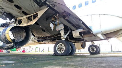 Old and damaged aircraft on the ground