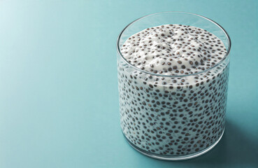 chia pudding bowl over bright simple blue background with empty copy space, vegan and superfood