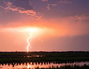 Stunning lightning strike illuminated sky as sun set, creating dramatic scene over tranquil water