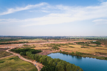 Aerial View of a Quarry Landscape with Water Feature
