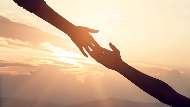 A symbolic image of two hands reaching out toward each other against a glowing sunset sky, representing help, support, unity, hope, trust, and emotional connection