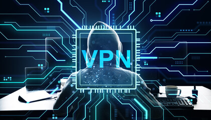 Person wearing hoodie using computer with VPN text overlay and digital circuit background representing cybersecurity and data protection concept.