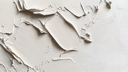Abstract texture of thick, layered paint strokes in light beige.