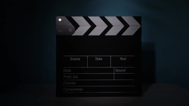 cinema clapperboard, dramatic lighting shift, filmmaking essentials, scene marking process, action recording, Hollywood media industry, digital storytelling, movie sequence setup, performance marking