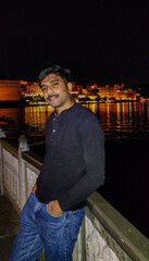 Man standing in front of city palace Udaipur 