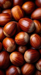 Obraz premium Hazelnut closeup with smooth brown shell texture, natural healthy food, fresh organic nuts in warm lighting