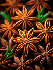 Star anise pods closeup with green leaves, natural spice arrangement, warm brown tones, aromatic and textured surface