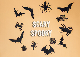 Black and white Halloween sign with bats and spiders
