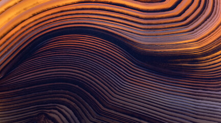 contrast orange and brown lines closeup of agate