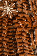 Snowflake Gingerbread Cookie Among Rows of Festive Holiday Treats