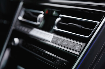 modern car dashboard featuring sleek air conditioning controls, digital display, and sleek design, showcasing luxury automotive technology and interior efficiency for enhanced driving experience