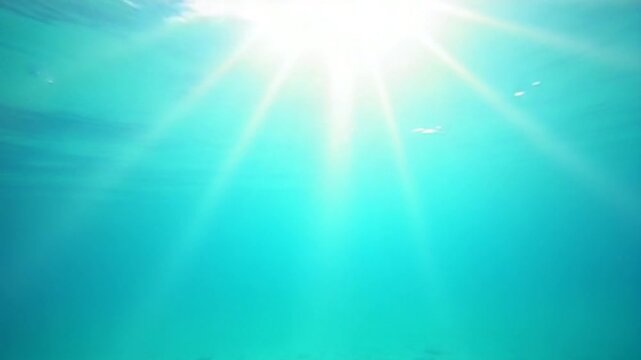 Sea water surface. Low angle view over clear azure sea water. Sun glare. Abstract nautical summer ocean nature. Holiday, vacation and travel concept. Nobody. Slow motion. Weather and climate change