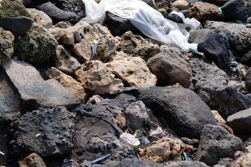 This image depicts the reality behind the natural beauty that we often overlook. Piles of natural rocks interact with plastic waste and other waste, showing the impact of pollution on our environment.