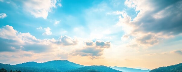 Fototapeta premium Scenic mountain range under a bright cloudy sky natural landscape panoramic view