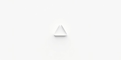 A minimalist white triangle shape on a plain white background, symbolizing simplicity, geometry, and design
