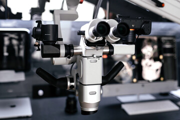 Dental binocular microscope in the dentist's office. Optical instrument for diagnosis and treatment in surgery and dentistry.