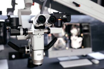 Dental endodontic binocular microscope in a modern clinic close-up. Dental optics. Dental equipment.
