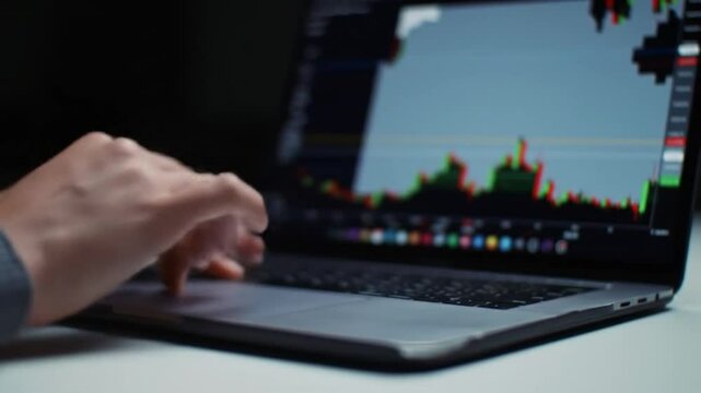 Analyzing Stock Market Trends A Close-Up View of Data Analysis on Laptop