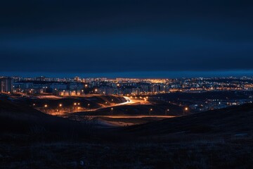 Obraz premium Night cityscape panorama from a hilltop
