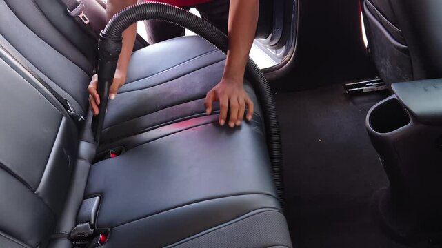 Professional car interior vacuuming service that guarantees spotless cleaning results