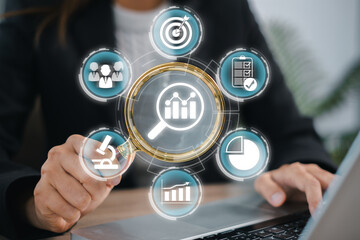 A business professional analyzing market trends using digital tools and data visualization for strategic insights.