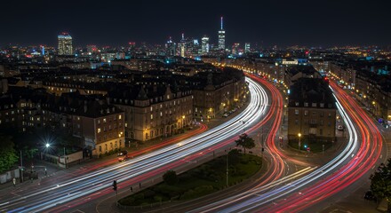 Fototapeta premium Nighttime Cityscape with Long Exposure Traffic Trails and Illuminated Buildings