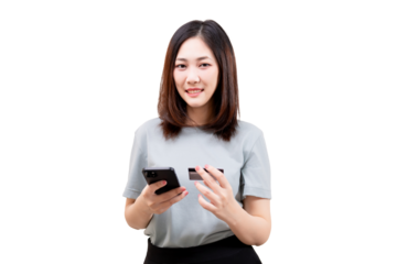 Asian young beautiful woman holding a smartphone and a credit card, appearing to make an online transaction.