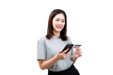 Fototapeta premium Asian young beautiful woman is holding a smartphone and a credit card, smiling confidently.