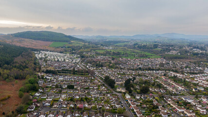 Aerial view of coast of Irish Sea and Mourne Mountains in Newcastle, Northern Ireland. Drone photo of Coastal City and water. 