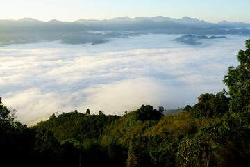 Serene Mountain Landscape with Misty Fog Over Rolling Hills at Dawn