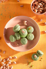Sweet and creamy pistachio macarons made of meringue and nuts.