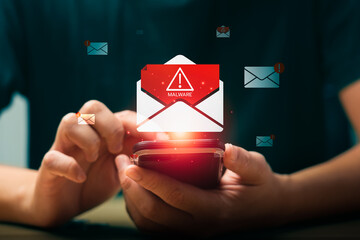 Mobile phone with floating malware warning email icon, representing cybersecurity threat, phishing...