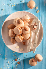 Fresh and tasty nut macarons with mix of brown nuts.
