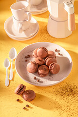 Homemade and creamy coffee macarons made of chocolate and sugar.