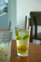Songkit iced drink on the table. Summer drink, tropical drink concept. Es jeruk
