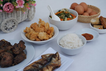 A Complete Indonesian Meal Rice, Fried Chicken, Vegetables and Eggs
