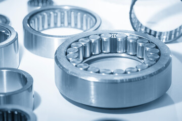 Close up scene assembly of the cylindrical rolling bearing parts in the light blue scene.