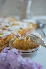 Freshly baked rhubarb crumble cake pieces on plate