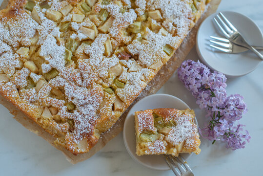 Freshly baked rhubarb crumble cake pieces on plate
