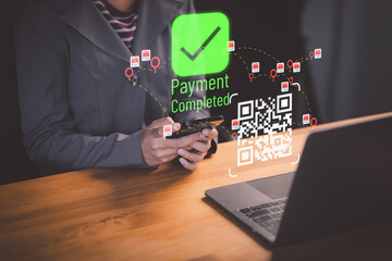 Female client using smartphone to scan QR code to make payment. Customer making payment through mobile phone and scan code for online shopping. Secure online payment, Digital banking.