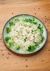 Creamy Risotto with Herbs on White Plate