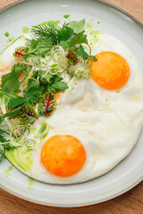 Top View of Egg Breakfast and Herbs