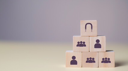 Representing brand loyalty and client engagement through CRM and marketing strategies. Human in Wooden cube relationships to strengthen customer connection.