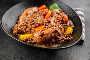 Sausage with lentils and vegetables appetizer vegetable dish fresh tasty gourmet food background on the table rustic food top view copy space